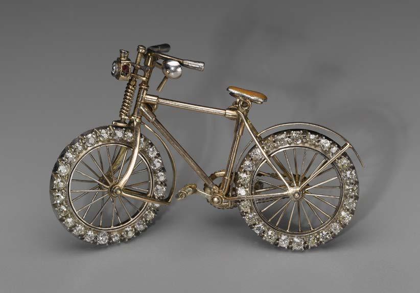 2009.2419 Bicycle brooch, possibly by Streeter & Co. Ltd. (English), mid-1890s. Gold, enamel, diamond (old brilliant cuts), and ruby. 4 x 6.5 x 1 cm. Museum purchase with funds donated anonymously.