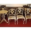 Wrought iron garden table, chair and 2 carvers