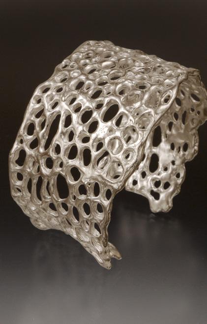I paint precious metal clay layer after layer to build up the thickness and enhance the elaborate honeycomb design.