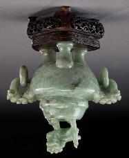 255 Chinese Qing carved jadeite censer, with a foo dog finial, two lion's