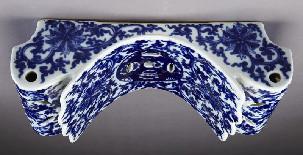 00 25 Chinese Qing blue and white porcelain pillow depicting lotus and coins, with a