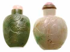 2 cm) Estimate: $1,500 / 2,000 6054 A Carved Agate Snuff Bottle The flattened rectangular form with rounded shoulders, carved in raised relief using the natural milky honey-toned inclusions of the