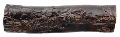 Height: 10 1/4 inches (26 cm) Estimate: $1,500 / 2,000 16 6077 A Zitan Landscape Wrist Rest The gentle naturalistic form carved with a horizontal landscape, depicting four figures and two small