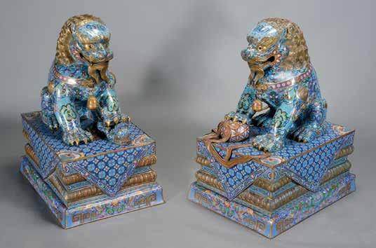 6092 A Large Pair of Cloisonné Enamel Buddhist Lions 20th Century The lions seated on their rear haunches, the lion s front paw raised over a ball and the lioness s front paw raised over a playful
