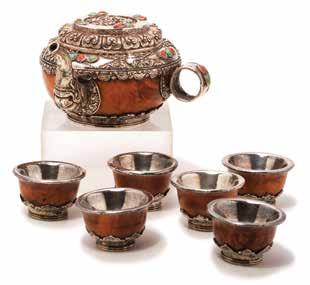 3 cm) Estimate: $5,000 / 7,000 6097 A Chinese Export Silver Bucket Late 19th/Early 20th Century Of octofoil form with double arching handles, the exterior displaying eight repoussè panels each