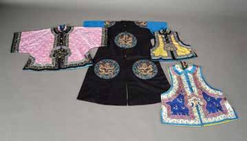 6126 A Group of Four Embroidered Garments The first a black gauze robe applied with eight roundels depicting sinuous dragons in couched giltwrapped threads and against a sky of colorful clouds and