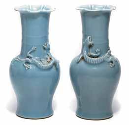, Los Angeles (according to the attached label) 6137 Two Underglaze Copper-Red and Blue Bottle Vases Kangxi Marks Each with a tall slender neck and globular body decorated in underglaze red with