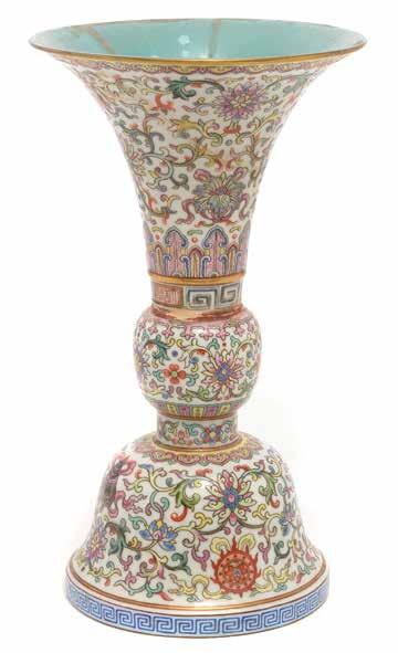 6151 A Famille Rose Vase Jiaqing Mark and of the Period The slender gu-form vase decorated to the exterior with The Eight Buddhist Emblems, interspersed by lotus scrolls and