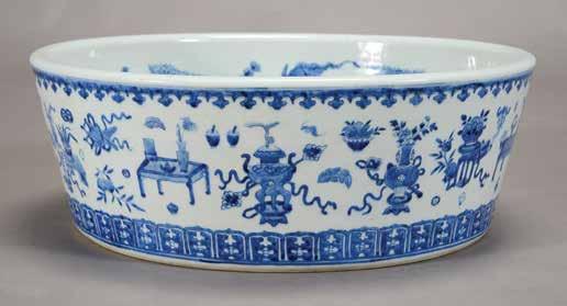 4 cm) Estimate: $3,000 / 5,000 6155 An Underglaze Blue and Yellow Enamel Dragon Bowl Kangxi Mark and of the Period Finely potted with rounded sides rising to a slightly everted rim, decorated around