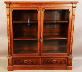 Lot #189 -American renaissance style walnut two door bookcase, wide burled