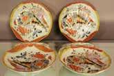 Lot # 27 - Four hand painted plates.