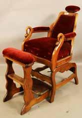 Lot #489 -American walnut Barbers chair with swans carved on