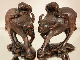 Lot #570- Pair of water buffalo, carved