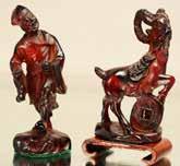 Lot # 80 - Two Chinese cherry amber figures.