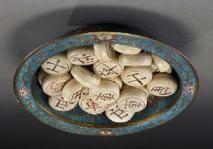 pieces, incised Chinese characters, set in a Qing cloisonne bowl depicting dragons. Chess pieces: 0.