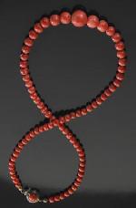 00 694 Chinese carved red coral necklace. regulations prior to bidding).
