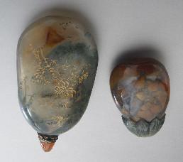 740 (2) Chinese Qing carved agate snuff bottles, one with gilt