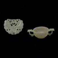 5 cm)} each approximately} 179 Four Jadeite Carvings Comprising a circular lidded box, low bowl, lotus theme pendant, and a circular pendant.