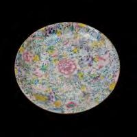 7 cm) each} 231 Mille Fleur Enameled Charger Republic Period Decorated with a profusion of flowers centered with a pink peony, bearing a spurious