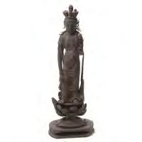 and supported on a gilt lotus pedestal raised on an elaborately carved hexagonal plinth. {Height: 26 1/2 inches (67.