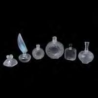 } 509 Group of Six Various Lalique Perfume Bottles. Includes a large and a small flower bottle, and an iridescent angel wing bottle.