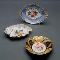 } 523 Pair of Berlin Figural Sweetmeat Dishes. Each a putti flanked by two baskets.