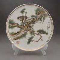 527 An Enamel-Painted Porcelain Wall Plate, 20th Century, Dated to 1956, executed in delicate enamel to depict two monkeys