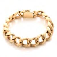 50 14k Yellow Gold Bracelet. The 14k yellow gold brushed curb link measuring approximately 12.