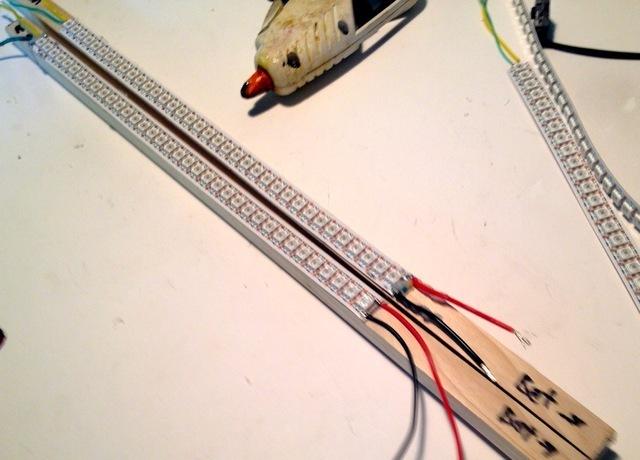 Put a dab of glue on each end of the battery and glue the dowels and battery into a long line. (Note: this glue is merely to make wiring and layout easier, it doesn't need to hold structurally).