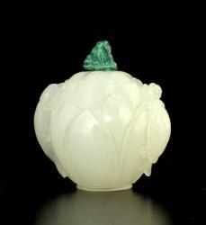 25" E: 400 / 500 0101-D WHITE GLASS SNUFF BOTTLE, imitating white jade, CARVED IN THE FORM OF A LOTUS, a cat fish and a turtle forming the handle. QING DYNASTYE. Stopper.