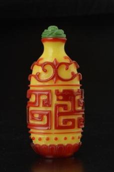 5" 0104-F YELLOW GLAZED MOLDED PORCELAIN SNUFF BOTTLE decorated with a bird on a flowering branch. Four character mark.