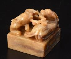 5 E : 800 / 1000 0015 TWO WHITE CELADON NEPHRITE PENDANTS with carved decor of a child, bird and dragon. The highest: 5.