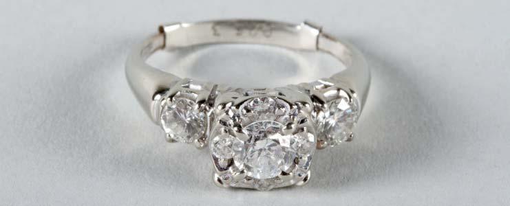5cm diameter Realised 1,500 52 14 carat gold ring, square cluster of five diamonds