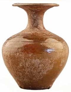 Fig. 18. Glazed ceramic jar from Tomb M1. Fig. 19. Glazed ceramic pot from Tomb M1. is 10.1 cm high [Fig. 18].