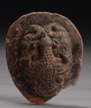 109. Inventory number: M34:25 Object title: Mould for ornament with eagle and tiger fighting design Dimensions: Length 5.2cm; Width 4.2cm; Thickness 0.