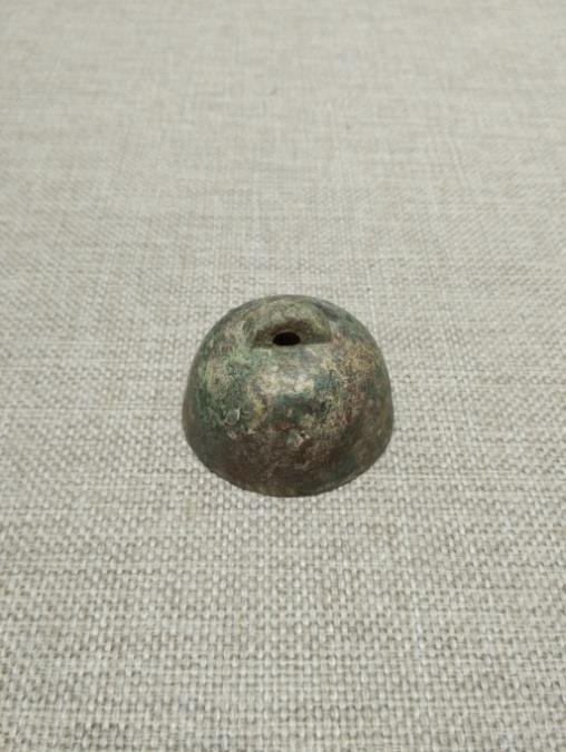 118. Inventory number: K4:27 Object title: Weight Dimensions: Height 3.5cm; Diameter 5cm Material: Bronze Date made: Han Period (206 BCE 220 CE) Shaanxi Institute of Archaeology No.