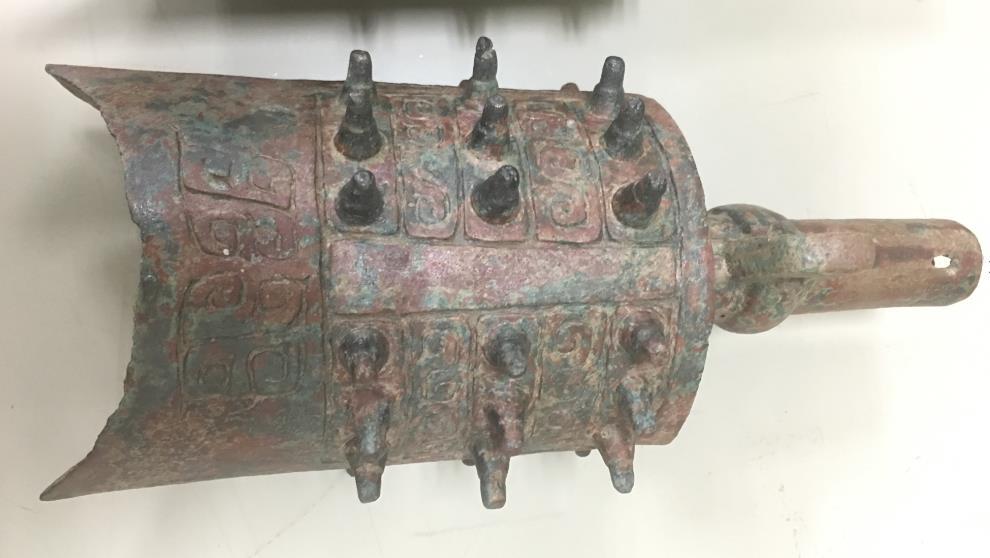 57. Inventory number: M28:3 Object title: Bianzhong (bell) with decoration. Dimensions: Height 20cm; Width 8cm; Length 8.