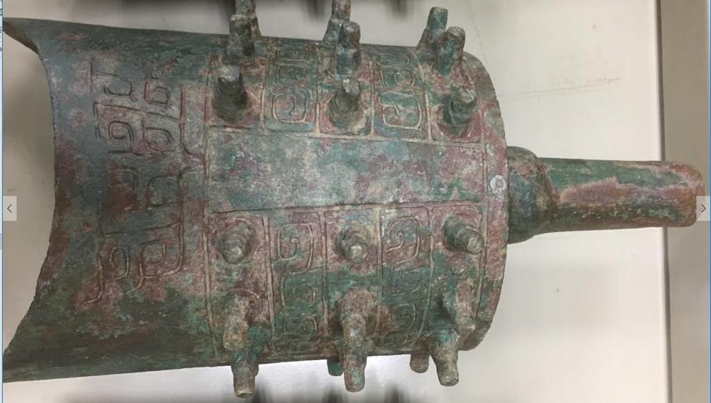 60. Inventory number: M28:7 Object title: Bianzhong (bell) with decoration. Dimensions: Height 27.5cm; Width 12cm;Length 13.