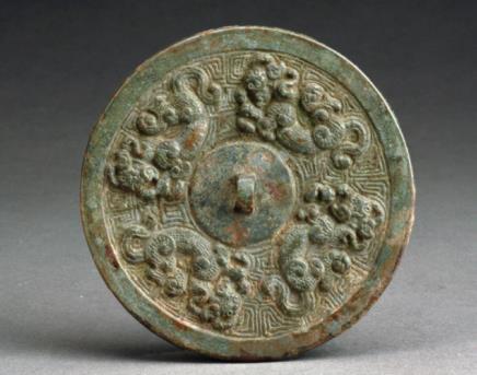 66. Inventory number: 87LBM23:9 Object title: Mirror decorated with four mythical creatures Dimensions: Diameter 6.