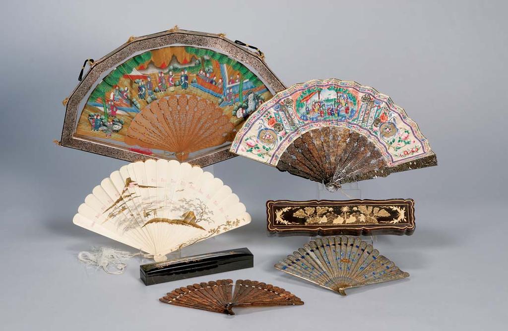 422 423 421 424 425 424. Tortoiseshell Fan, China, 19th century, carved and pierced with figures and garden pavilions, lg. 7 1/2 in. 425. Silver Fan, China, 19th century, cast and filigree work with blue and green enamels, lg.
