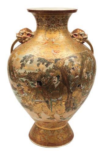 550 A large pair of Satsuma earthenware vases of baluster form with grotesque mask handles, decorated with panels containing