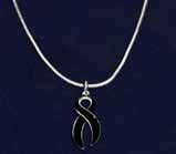 The necklace has 3 charms, two having black crystals and the third having black ribbons all the