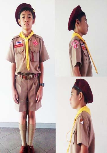 school s name Scout pack colour patch on left Brown Belt with Luk Sua insignia on brass buckle Dark brown canvas or leather shoes, khaki knee-high socks, folded over with crimson tassel attached on