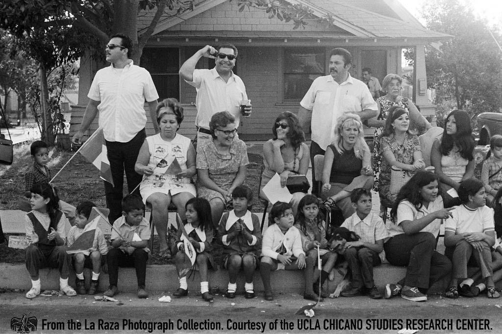 People watch the National Chicano Moratorium march to Laguna Park La Raza photograph collection.