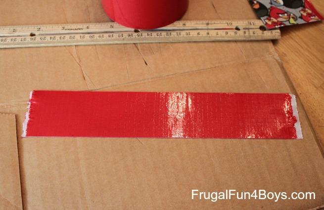 Tear a strip of duct tape in half lengthwise