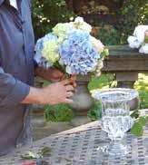 Start with the larger blooms first (hydrangeas) then fill in with