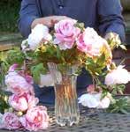 Cut the stems to fit in the vase starting from the bottom rim of the