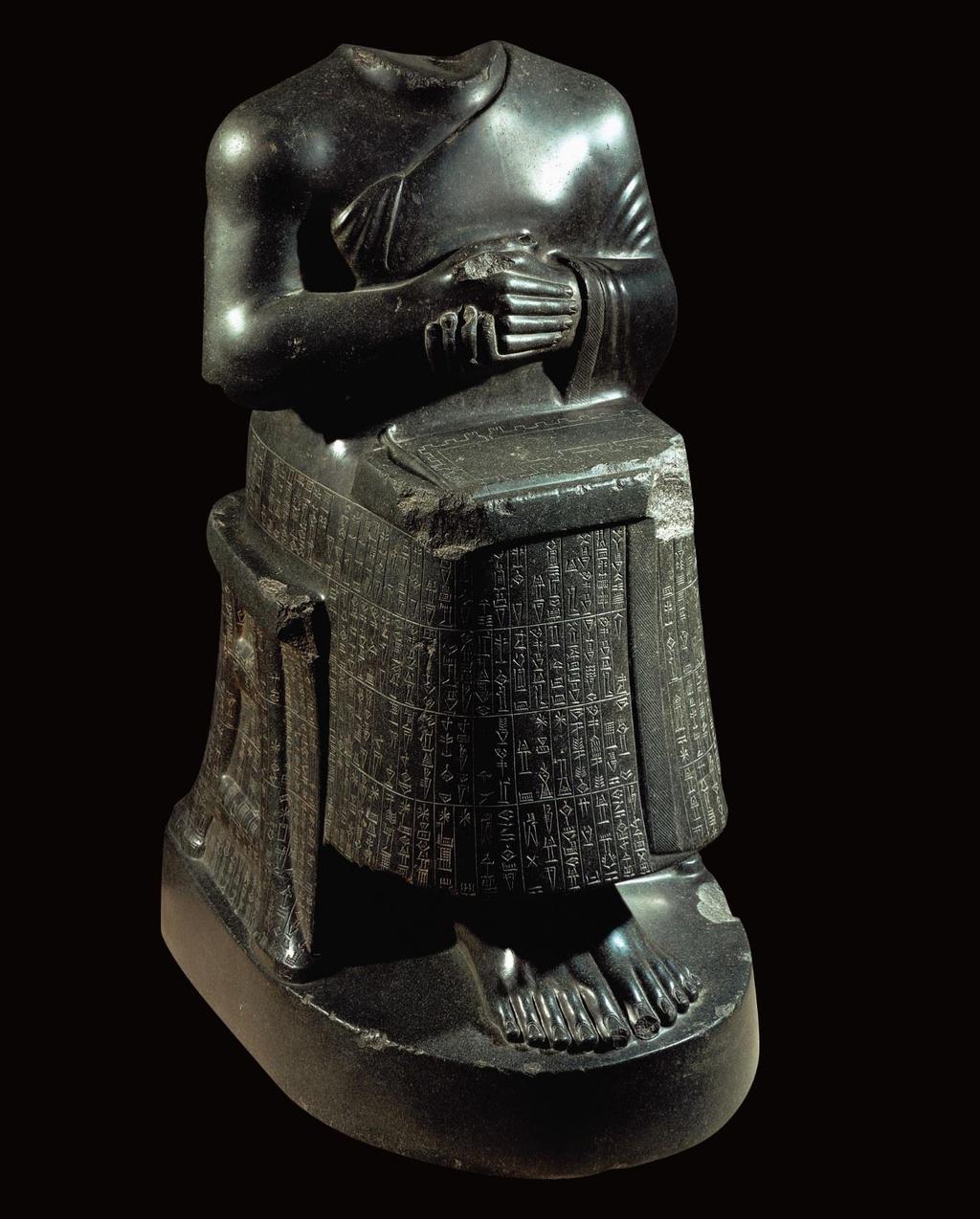 Figure 2-16 Seated statue of Gudea holding temple plan, from Girsu