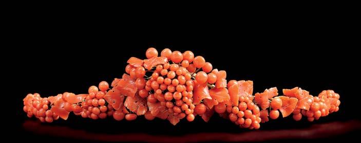 182 182. Antique Coral Diadem, designed as clusters of grapes and vines, together with three hair pins each set with coral beads, all with gilt mounts. $2,000-3,000 183.