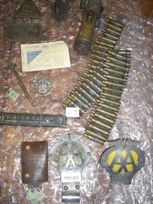 badges, ammunition belt, mini iron, old torch, rally